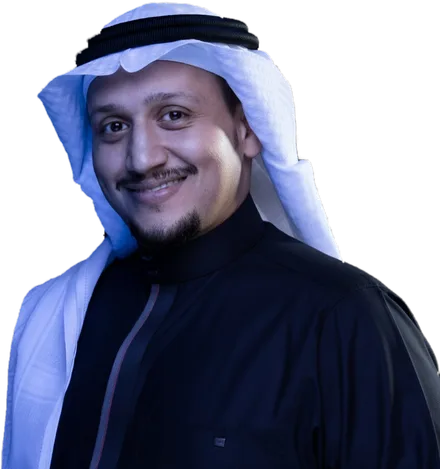 د. نايف البار مبتسمًا بالبشت والغترة
